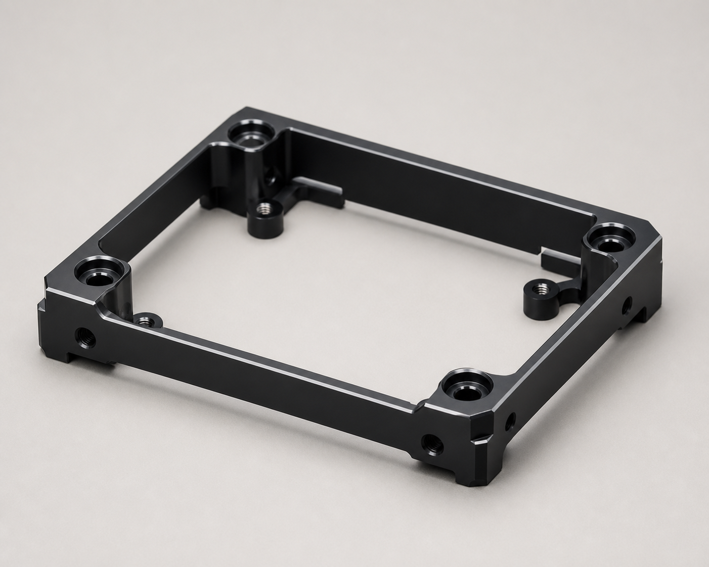 Black anodized CNC-machined PCB mounting frame