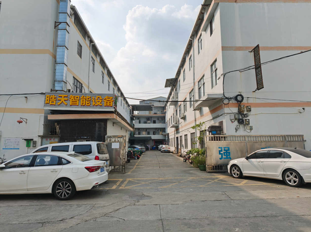 Exterior buildings and access lane at the Dongguan workshop site
