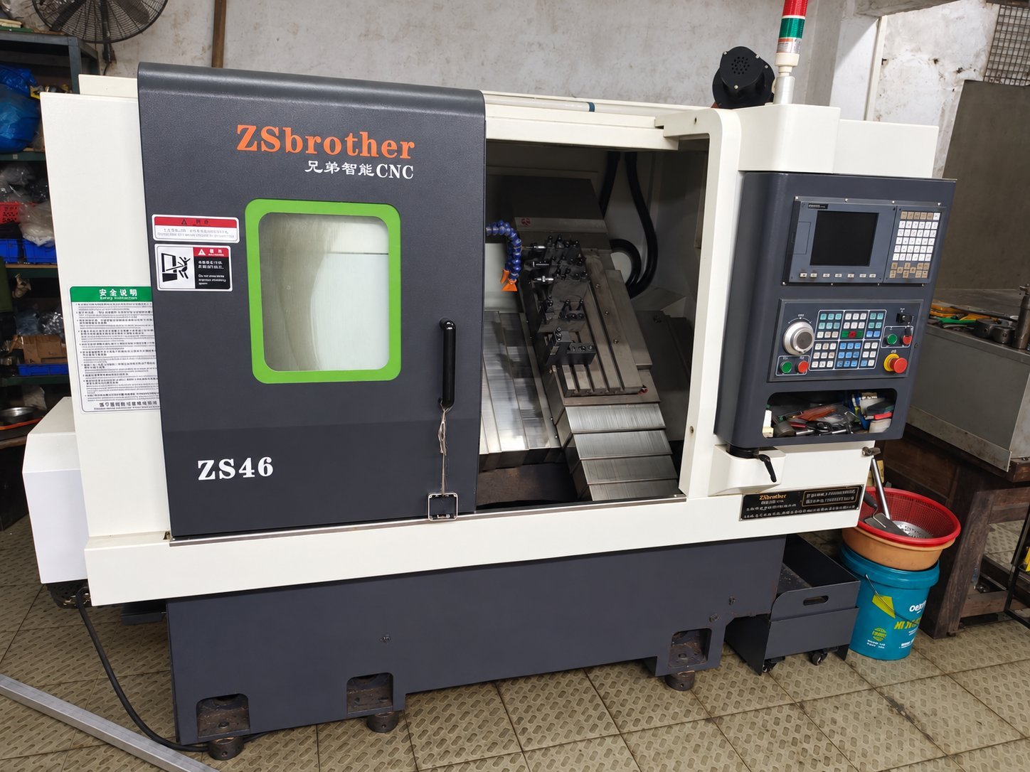 CNC lathe with the work area open during setup and tooling check